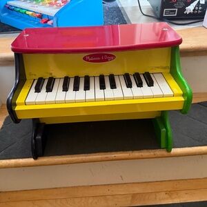 Melissa & Doug Wooden Toy Piano in Red, Yellow, Green, Black